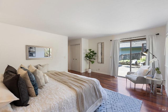 bedroom with wood finished floors and baseboards