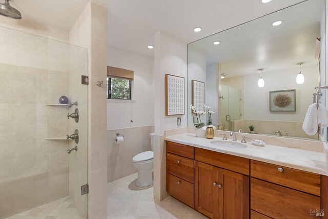 full bath featuring toilet, a stall shower, recessed lighting, and vanity