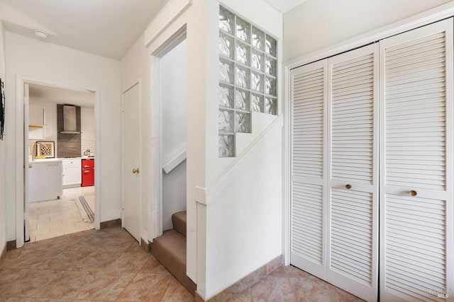 entrance foyer with stairway and light tile patterned floors