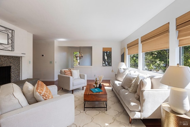 living room featuring visible vents, wood finished floors, and baseboards