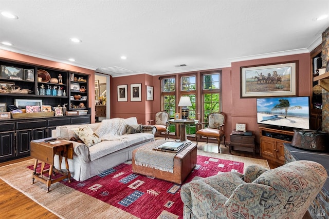living area featuring light wood-type flooring, visible vents, recessed lighting, and crown molding