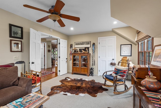 living room featuring recessed lighting, baseboards, light colored carpet, and ceiling fan