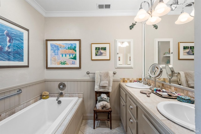 bathroom with a bath, a sink, visible vents, a chandelier, and crown molding