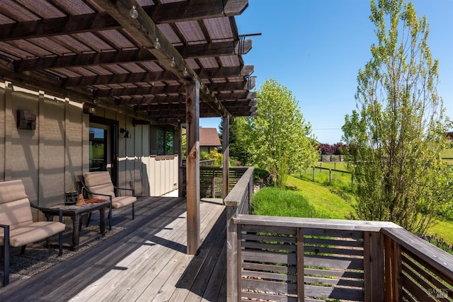 wooden terrace with a pergola, a lawn, and fence