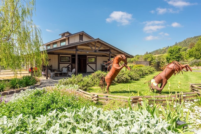 back of property featuring a patio area and fence
