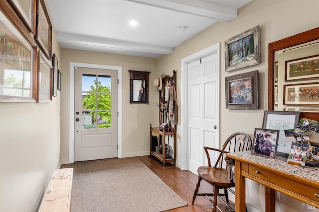 entryway with baseboards, wood finished floors, beam ceiling, and recessed lighting