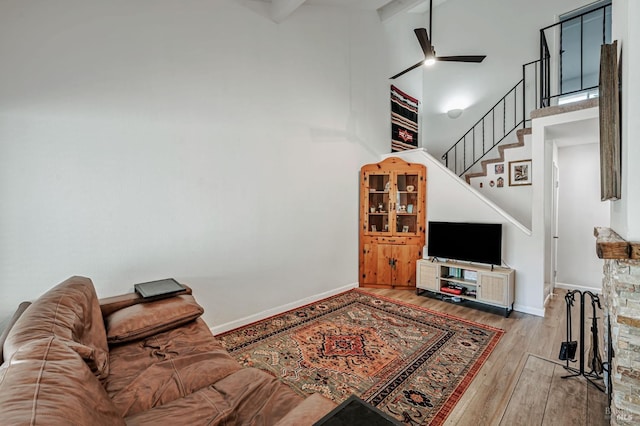 6482 Meadow Pines Ave, Rohnert Park, CA 94928 - living area with stairway, hardwood / wood-style flooring, a high ceiling, baseboards, and ceiling fan