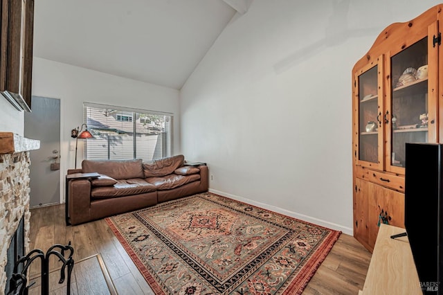 6482 Meadow Pines Ave, Rohnert Park, CA 94928 - living room featuring baseboards, high vaulted ceiling, and light wood-style flooring