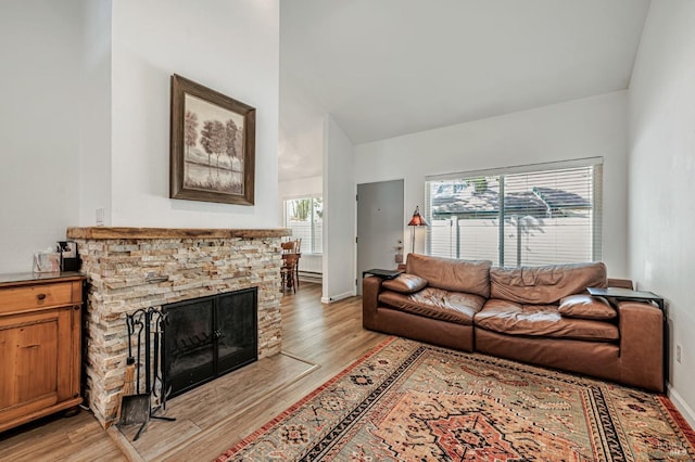 6482 Meadow Pines Ave, Rohnert Park, CA 94928 - living area with baseboards, light wood-type flooring, high vaulted ceiling, and a fireplace