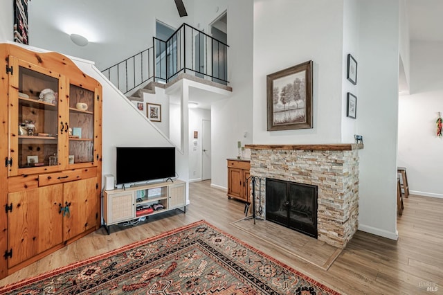 6482 Meadow Pines Ave, Rohnert Park, CA 94928 - living area with a high ceiling, baseboards, light wood-style floors, and stairway
