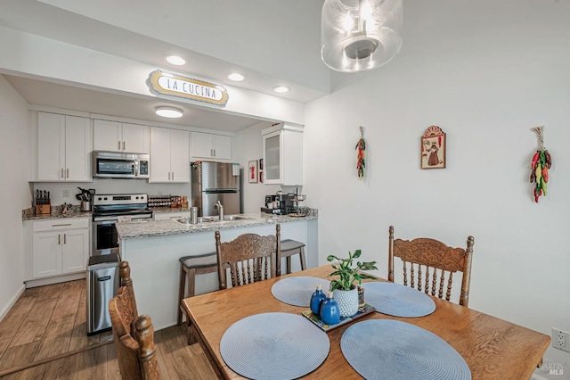 6482 Meadow Pines Ave, Rohnert Park, CA 94928 - dining room featuring wood finished floors and recessed lighting