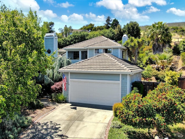 271 Antigua Way, Vallejo, CA 94591 - view of front of home featuring a chimney, a tile roof, and driveway