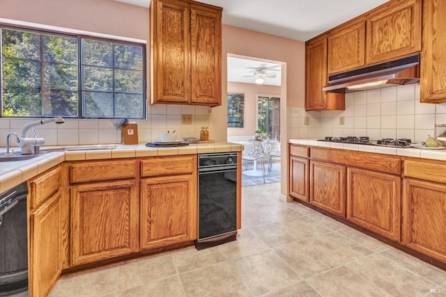 271 Antigua Way, Vallejo, CA 94591 - kitchen with under cabinet range hood, dishwasher, and decorative backsplash