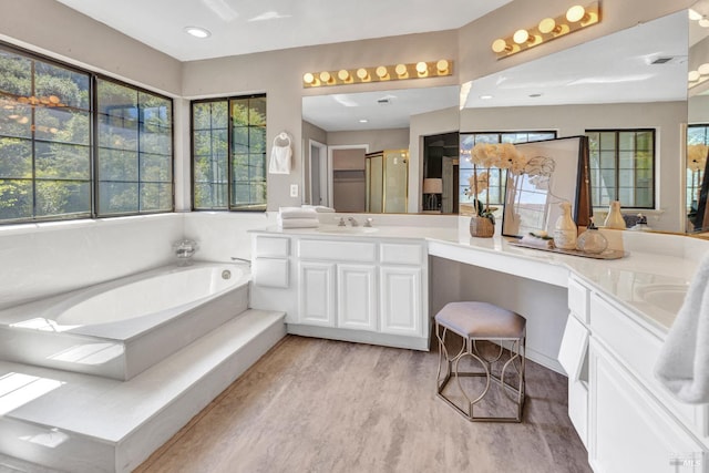 271 Antigua Way, Vallejo, CA 94591 - full bathroom with double vanity, plenty of natural light, a garden tub, and wood finished floors