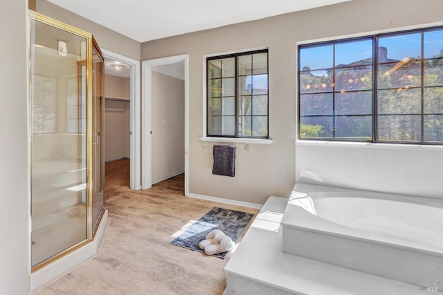 271 Antigua Way, Vallejo, CA 94591 - full bathroom featuring a shower stall, a garden tub, a walk in closet, and baseboards