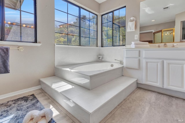 271 Antigua Way, Vallejo, CA 94591 - full bathroom with a garden tub, vanity, and baseboards