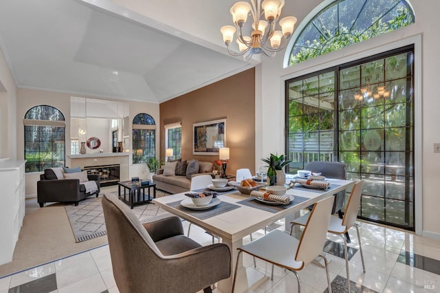 271 Antigua Way, Vallejo, CA 94591 - dining space with a chandelier, healthy amount of natural light, light tile patterned floors, crown molding, and a glass covered fireplace