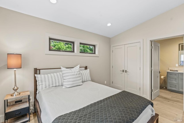 1108 Raymond Ave, Napa, CA 94559 - bedroom with connected bathroom, light wood-type flooring, a closet, vaulted ceiling, and recessed lighting