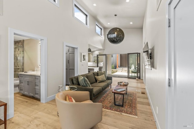 1108 Raymond Ave, Napa, CA 94559 - living room with recessed lighting, a high ceiling, light wood-type flooring, and baseboards