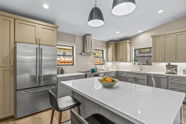 1108 Raymond Ave, Napa, CA 94559 - kitchen with a sink, light countertops, appliances with stainless steel finishes, and wall chimney exhaust hood