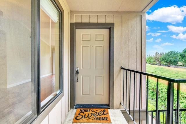 entrance to property with a balcony