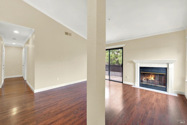 unfurnished living room with a fireplace with flush hearth, baseboards, wood finished floors, and visible vents
