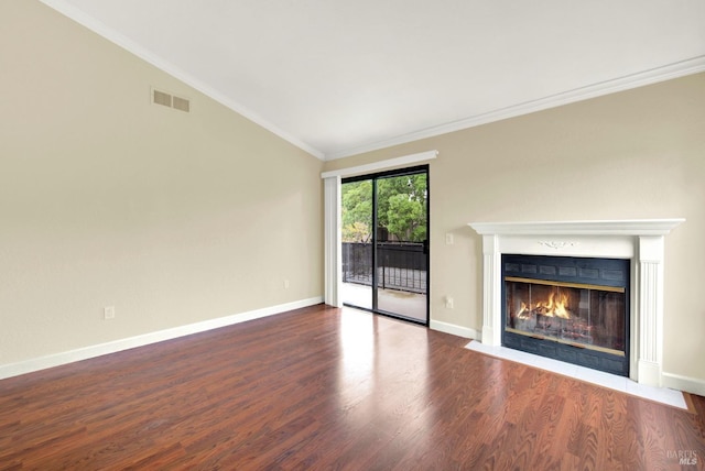 unfurnished living room featuring wood finished floors, a fireplace with flush hearth, baseboards, lofted ceiling, and visible vents