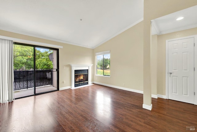 unfurnished living room featuring vaulted ceiling, crown molding, wood finished floors, a fireplace with flush hearth, and baseboards
