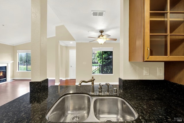 kitchen with open floor plan, visible vents, a sink, and a wealth of natural light