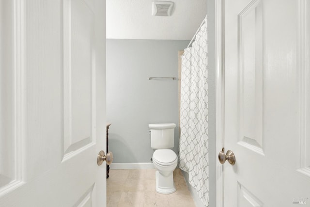 bathroom with visible vents, tile patterned flooring, and toilet