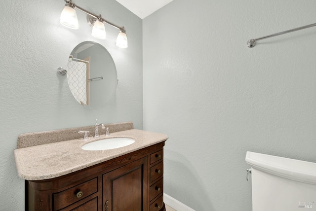full bathroom with vanity and toilet