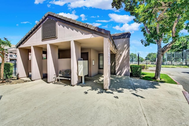 back of house with fence