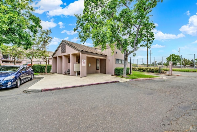 ranch-style house with fence