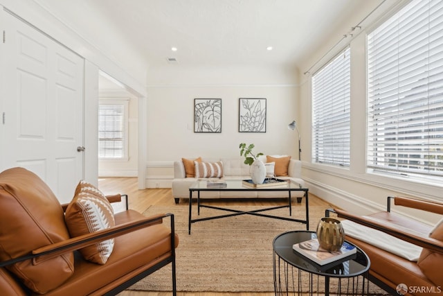 sitting room with visible vents, recessed lighting, baseboards, and wood finished floors