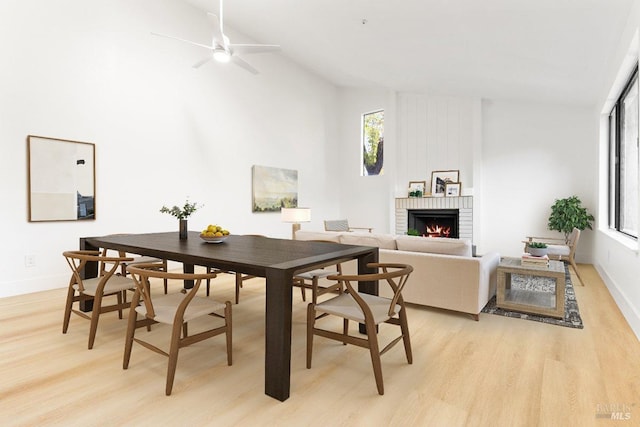 850 E Cotati Ave Unit 13, Cotati, CA 94931 - dining room with a brick fireplace, light wood finished floors, ceiling fan, baseboards, and high vaulted ceiling