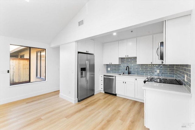 850 E Cotati Ave Unit 13, Cotati, CA 94931 - kitchen featuring stainless steel appliances, a sink, light countertops, tasteful backsplash, and light wood-style floors