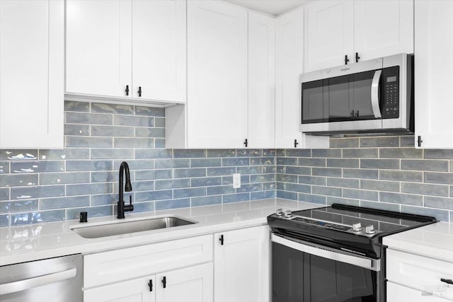 850 E Cotati Ave Unit 13, Cotati, CA 94931 - kitchen featuring stainless steel appliances, a sink, decorative backsplash, and light countertops