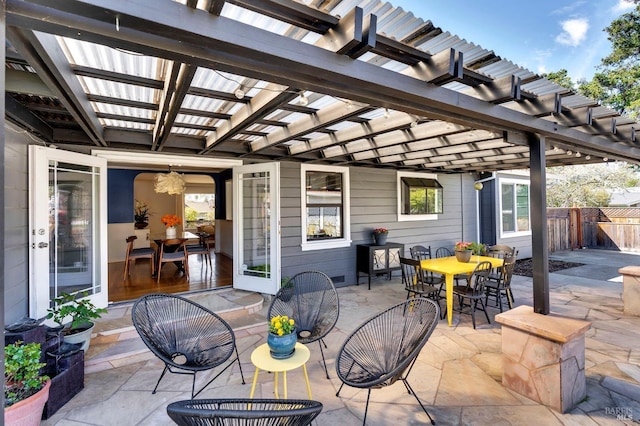 view of patio / terrace featuring outdoor dining area, a pergola, and fence