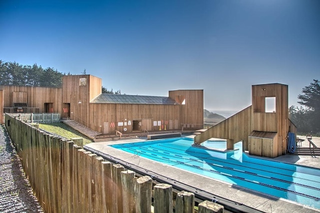 community pool featuring fence