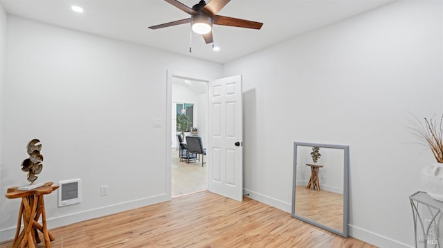 interior space featuring a ceiling fan, visible vents, recessed lighting, light wood finished floors, and baseboards