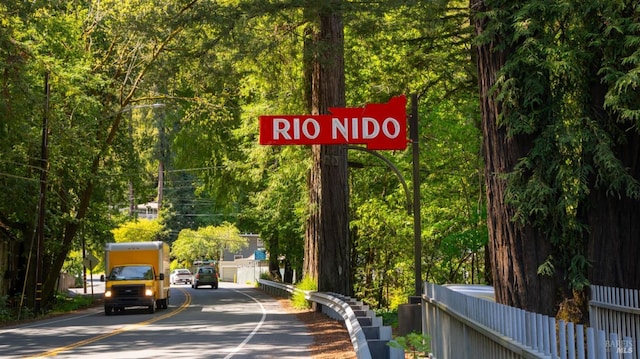view of street featuring a wooded view
