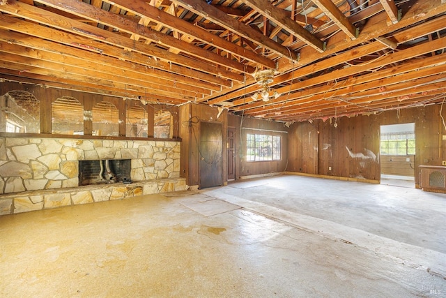 basement with a stone fireplace
