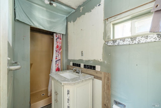full bath with vanity and walk in shower