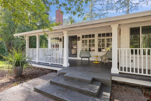 4040 Burnside Rd, Sebastopol, CA 95472 - view of front of property featuring a porch, aphalt driveway, and a carport