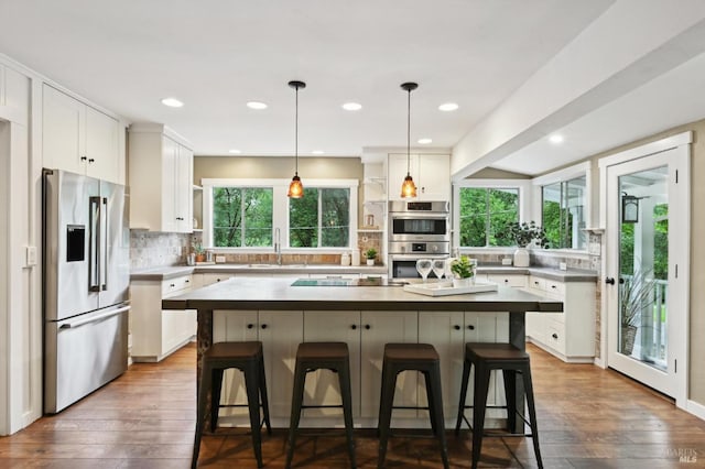 4040 Burnside Rd, Sebastopol, CA 95472 - living area featuring a fireplace, ceiling fan, wooden ceiling, wood-type flooring, and vaulted ceiling with beams