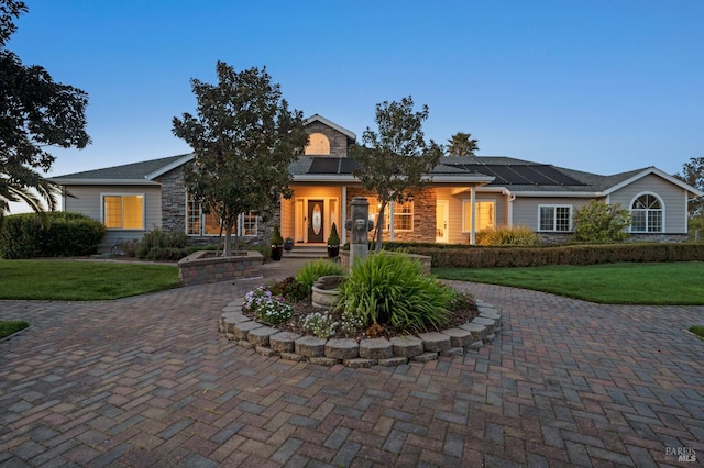 146 Shelina Vista Ln, Petaluma, CA 94952 - view of front of property with roof mounted solar panels, a front yard, and stone siding