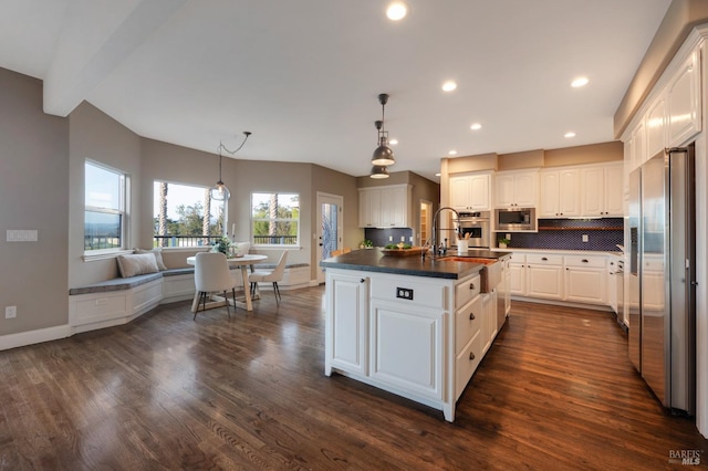 146 Shelina Vista Ln, Petaluma, CA 94952 - kitchen featuring appliances with stainless steel finishes, dark wood-style flooring, dark countertops, and white cabinetry