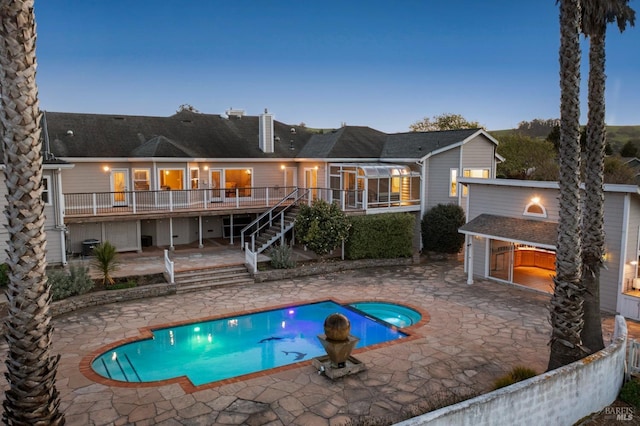 146 Shelina Vista Ln, Petaluma, CA 94952 - back of house at dusk with a patio, a shingled roof, a wooden deck, and stairway