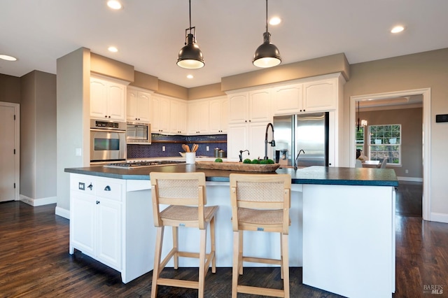 146 Shelina Vista Ln, Petaluma, CA 94952 - kitchen featuring appliances with stainless steel finishes, dark countertops, backsplash, and baseboards