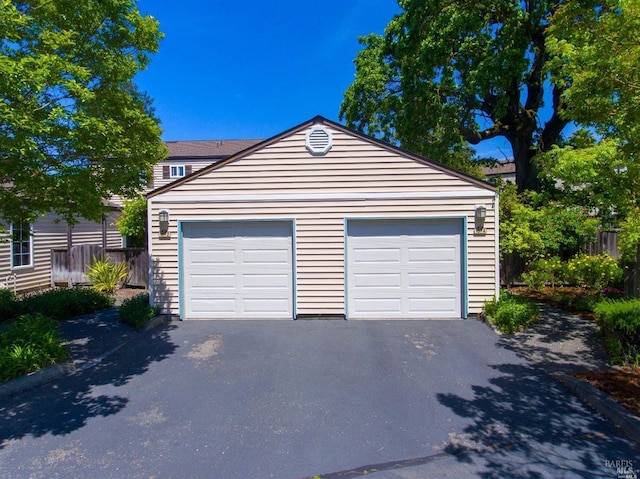 garage featuring driveway